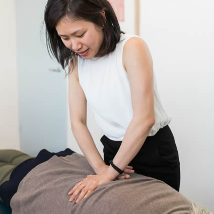 Chiropractor demonstrating precise joint contact before an Activator adjustment in Canberra