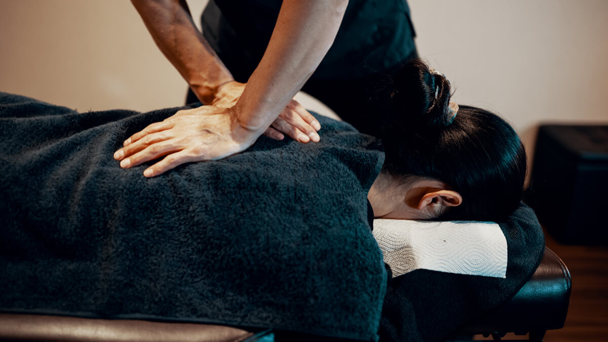 A person receiving care for lower back and sciatic nerve pain