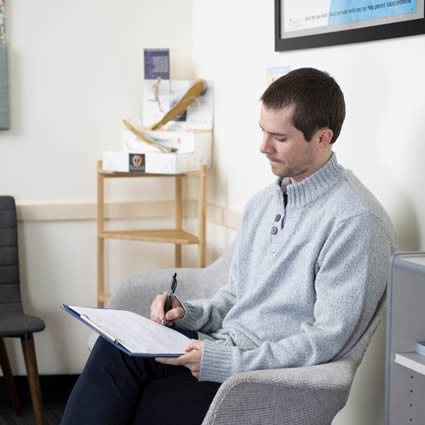 A well set-up office desk for a Canberra worker, part of a practical ergonomics guide