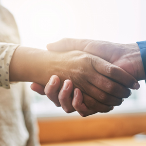 Honest referral handshake reflecting our chiropractic care promise in Canberra